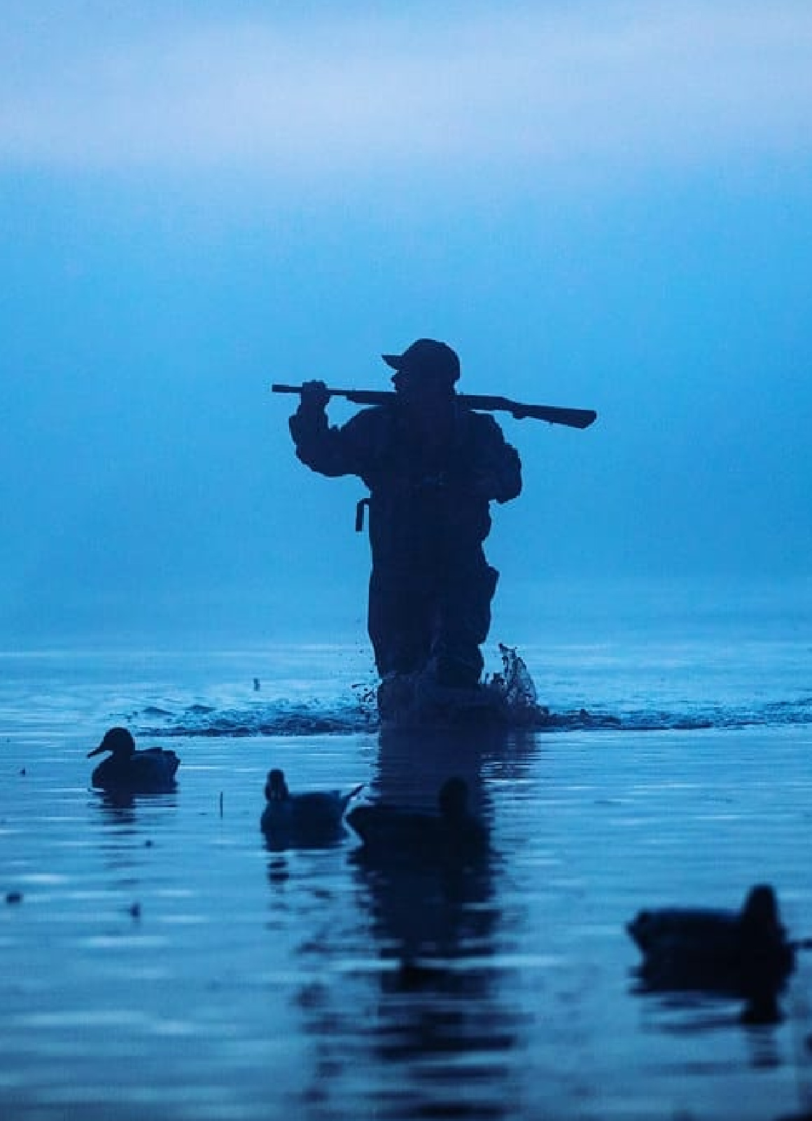 Hunter standing over decoys in Perry, Oklahoma.