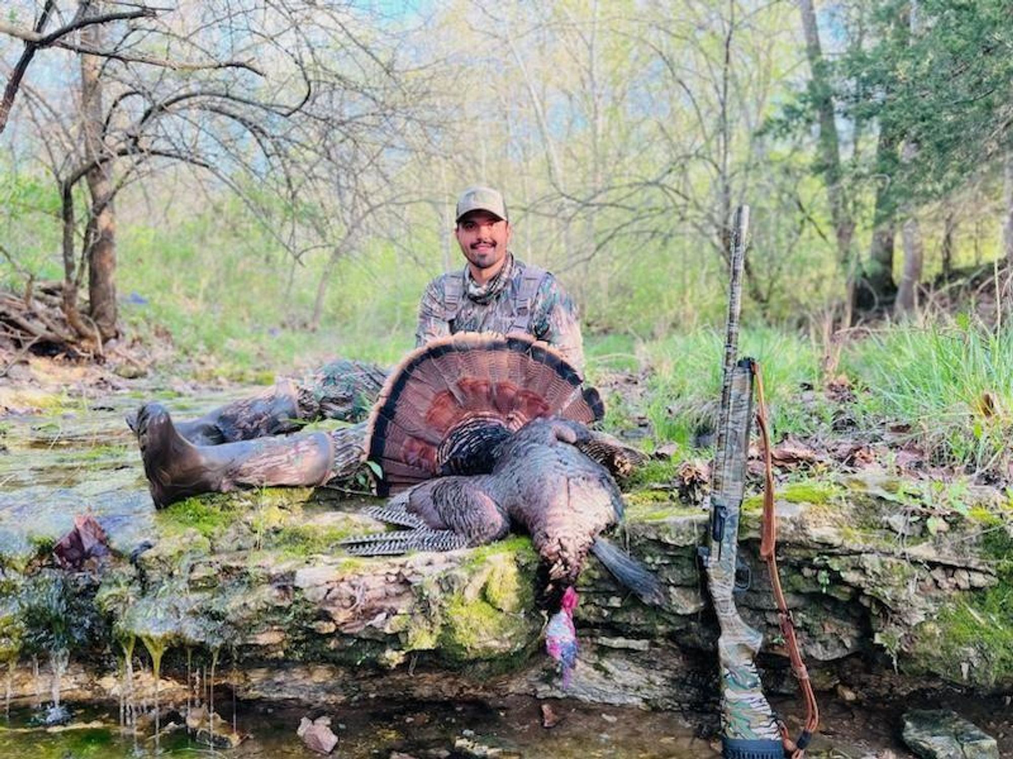 Hunter shown with his turkey harvested in Missouri.