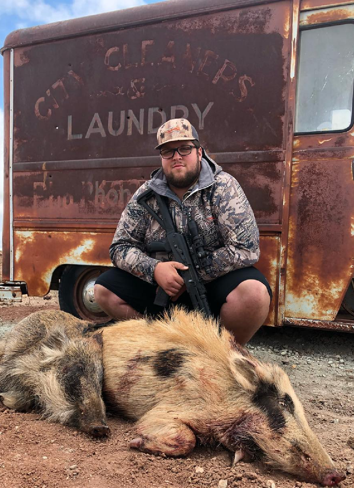 Bow hunter shown with turkey after a successful Spring turkey hunt in the Pacific Northwest, either Idaho or Washington state.