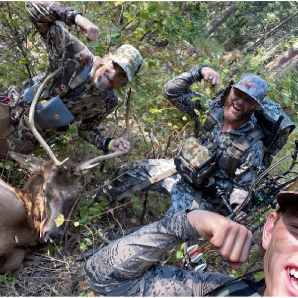 Bow hunter shown with turkey after a successful Spring turkey hunt in the Pacific Northwest, either Idaho or Washington state.