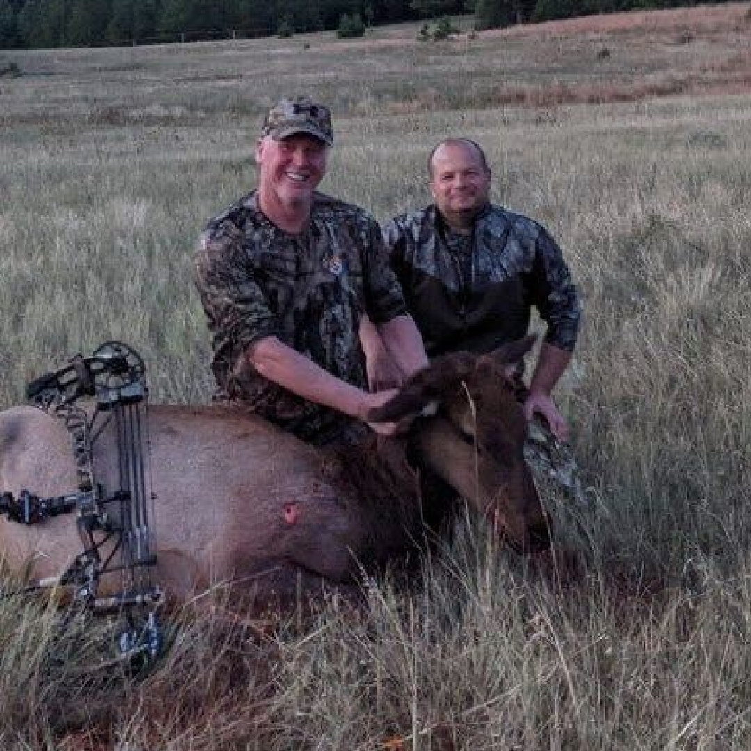 Bow hunter shown with turkey after a successful Spring turkey hunt in the Pacific Northwest, either Idaho or Washington state.