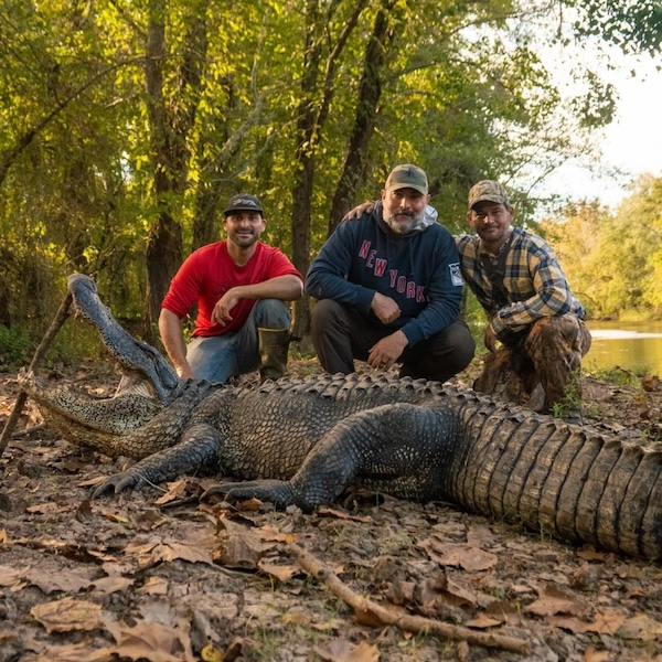 Bow hunter shown with turkey after a successful Spring turkey hunt in the Pacific Northwest, either Idaho or Washington state.