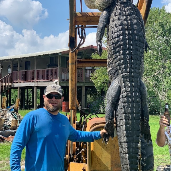 Florida Osceola Turkey Hunt, Hunter shown with turkey surrounded by oranges in Florida.